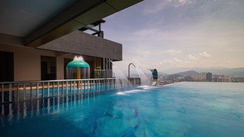 sunny day kuala lumpur downtown famous hotel rooftop swimming pool panorama 4k timelapse malaysia