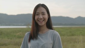 Portrait of beautiful young Asian woman smiling look at camera enjoying having fun together a summer traveling. Asian friends' lifestyle travels holiday vacation time.
