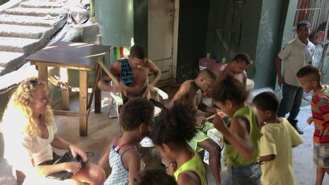 Rio de Janeiro / Brazil - 03 19 2019: Kids dancing to the drums in the a favela in Brazil.