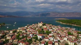 Aerial drone video from picturesque seaside fishing village and port of historic Galaxidi, Fokida, Greece