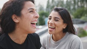 Two Female Friends Meeting In Urban Skate Park - Powered by Shutterstock - Get 15% off with code: PIKWIZARD15