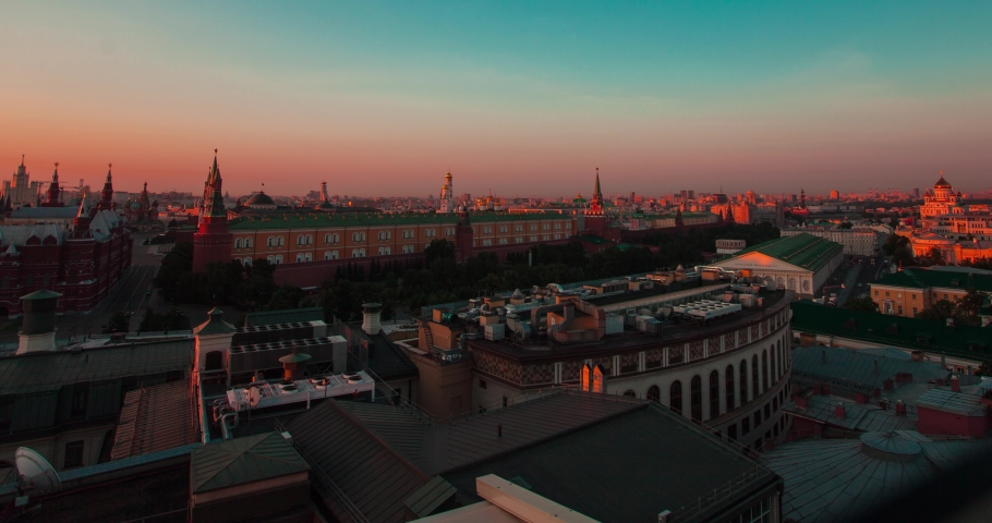 Time lapse of Moscow Kremlin and other buildings on the Red Square from day to night and around with people walking on the streets. Clear sky on the warm summer weather. Static view
