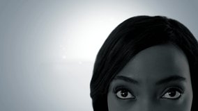 Animation of a globe spinning with data and connection network with a front view of the face of a young African American woman looking up on a grey background - Powered by Shutterstock - Get 15% off with code: PIKWIZARD15