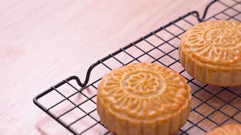 Fresh baked Chinese moon cake pastry for traditional Mid-Autumn festival, close up, truck shot movement. 4K Resolution.