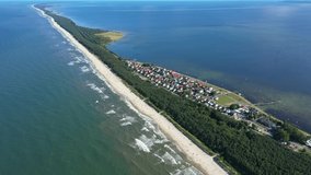 Beach in beautiful city Chalupy resort in Poland. Aerial video. Baltic Sea.Waves coming in.