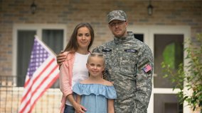 Happy american patriots family looking at camera, social insurance for veterans - Powered by Shutterstock - Get 15% off with code: PIKWIZARD15