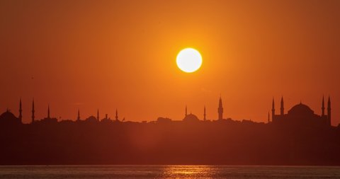 Time Lapse of sunset in Istanbul Bosphorus where ferries are passing by