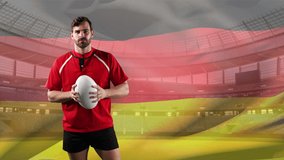 Animation of a Caucasian male rugby player holding and pointing wih a ball and looking to camera with blowing German flag and stadium in the background - Powered by Shutterstock - Get 15% off with code: PIKWIZARD15