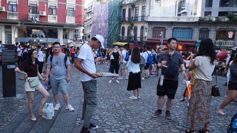 Macau - July 24, 2019 : slow-motion of people at the historical district Christ church old of Macau, Historic Center of Macao. Awesome view of the Ruins of St. Paul's. Macau