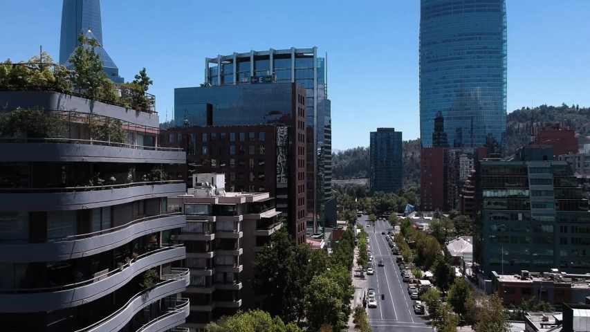 Aerial footage trough buildings getting close to apartment building