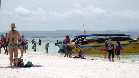 Krabi , Krabi / Thailand - 05 29 2019: Travelers travel to the island by boat to see the beauty and sunbathing at the beach front, with a long beach, suitable for swimming at Krabi in Thailand. Slow M