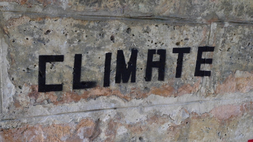 Climate Change Equals Human Extinction graffiti under a bridge in a european city. Panoramic shot Royalty-Free Stock Footage #1035175211