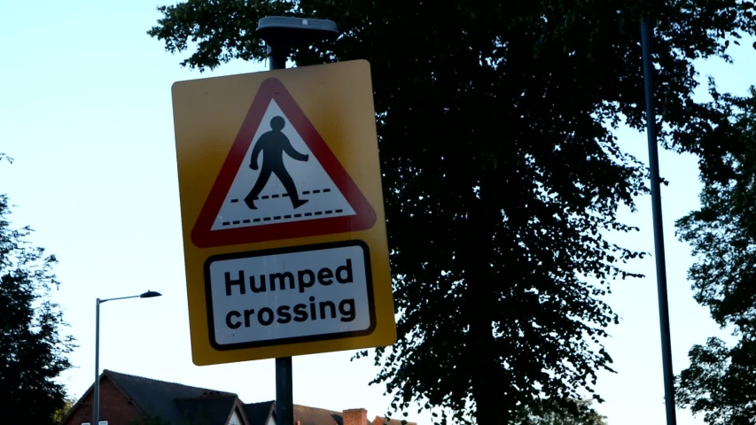 Humped Crossing Traffic Sign During Day