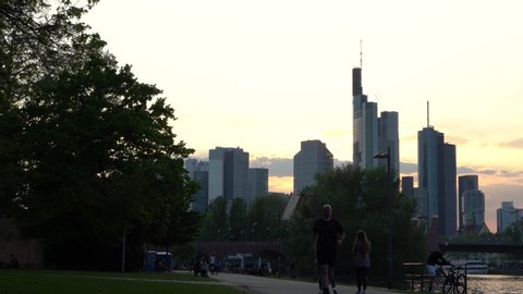 Frankfurt , Hesse / Germany - 05 01 2019: Downtown Frankfurt skyline from peaceful park at sunset
