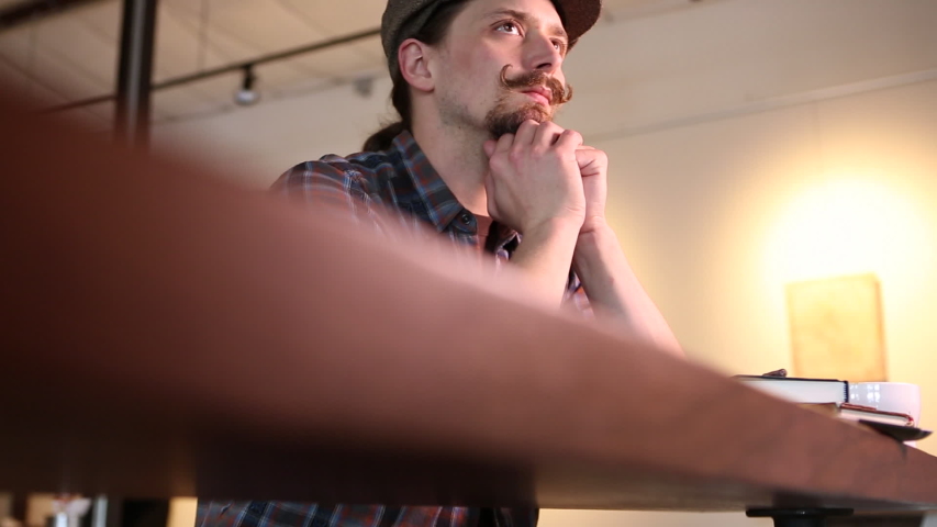 Caucasian man drinking coffee in cafe