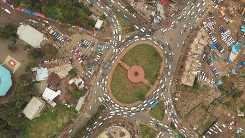 Beautiful bird's eye view of slow driving traffic on roundabout during rush hour in suburbs Addis Ababa, urban development in Ethiopia Africa
