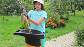 Garden garbage shredder. Girl is easily controlled with a mechanism
