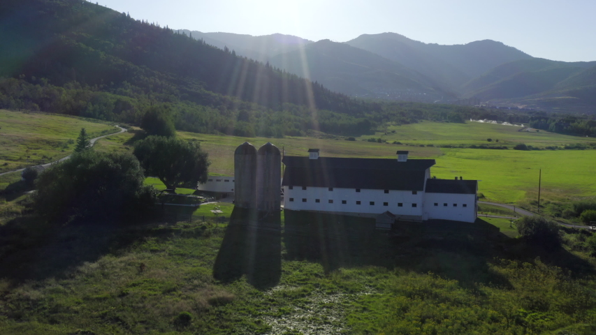 Aerial drone of the white, historic McPolin Barn in summer, Park City, Utah shot in UHD.
