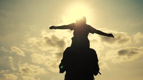 happy family silhouette teamwork kid dream concept . son boy superhero sitting on his father man neck depicts a flight of an airplane playing a pilot. happy family father and kid son silhouette dream - Powered by Shutterstock - Get 15% off with code: PIKWIZARD15