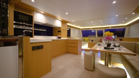 Interior of private yacht saloon with beautiful designed cabinets & table Phuket Thailand February 2017
