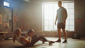 Beautiful Young Girl Exercises with Personal Trainer, Doing Sit-ups with Medicine Ball, Throwing Pass Back and Forth. Fit and Strong Couple Workout. Exercising Strength, Cardio and Power - Powered by Shutterstock - Get 15% off with code: PIKWIZARD15