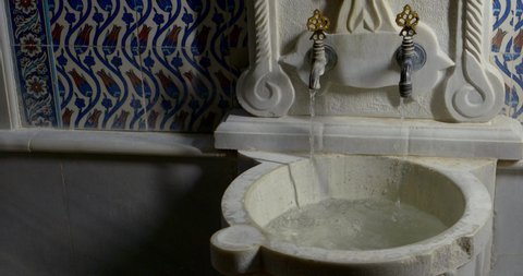 Water flows from the taps and from the storage bowl in the Turkish bath