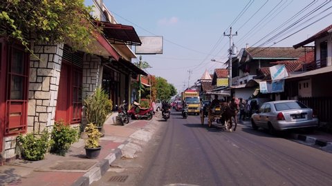 Jogjakarta / Indonesia - July 3rd, 2019: Establish Shot of Traffic in Yogyakarta Street in The Morning
