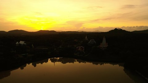 Aerial video of Wat Yannasang Wararam Buddhist Temple with sunrise in the morning, Pattaya city of Thailand