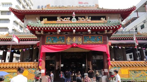 Chinatown / Singapore - August 16th 2019: Devotees are offering prayer in a Buddhist temple in Chinatown.