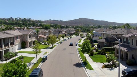 Aerial view of a street with big similar villas next to each other, San Diego, California, USA. Residential modern subdivision luxury house.