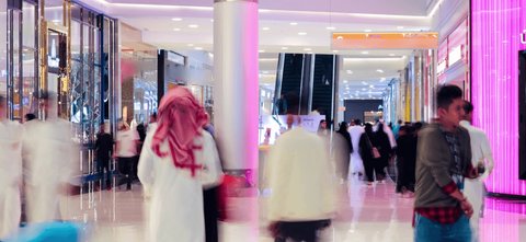 riyadh Saudi Arabia 08-21-2019 indoor time lapse crowd of people in a shopping mall in with motion blur 