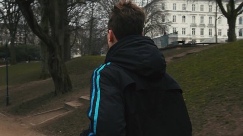Copenhagen / Denmark - 03 30 2019: Person running in the park
