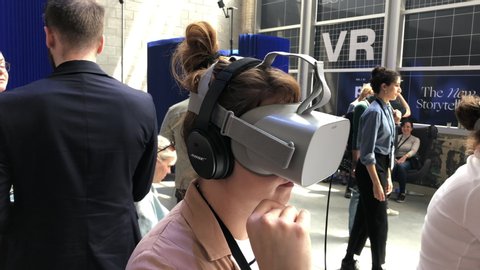 Montreal , QC / Canada - 05 22 2019: Woman using VR