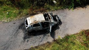 Still video of a stolen car after it has been burnt out to destroy evidence