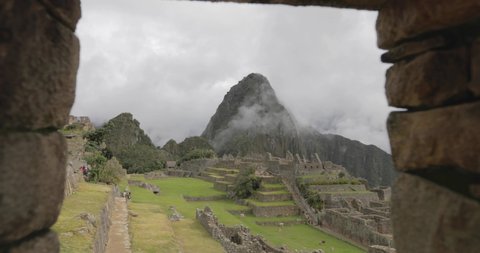 View of Machu Picchu through a window in the ruins