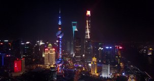 Stock video

SHANGHAI, CHINA - 2017 Aerial drone video, night time illuminated famous pudong cityscape, business finance centre skyscrapers skyline, Huangpu river , historical and modern architecture