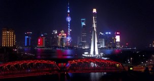 Stock video

SHANGHAI, CHINA - 2017 Aerial drone video, night time illuminated famous pudong cityscape, business finance centre skyscrapers skyline, Huangpu river , historical and modern architecture