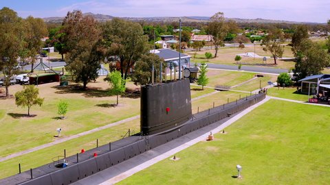 Holbrook / Australia - 10 27 2018: Flying tracking shot of Oberon class submarine museum in town.