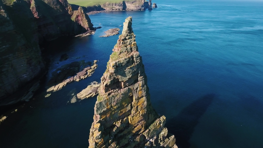 Aerial shot of Duncasby Stacks in Scotland, sunny day in 4K
