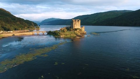Famous Eilean Donan Castle in Scotland aerial shot from drone