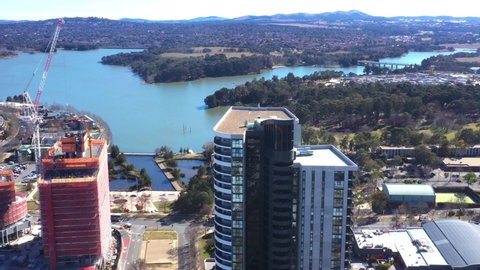 Aerial view circling the Wayfarer high rise residential apartment building located in Belconnen, Canberra, the capital of Australia      