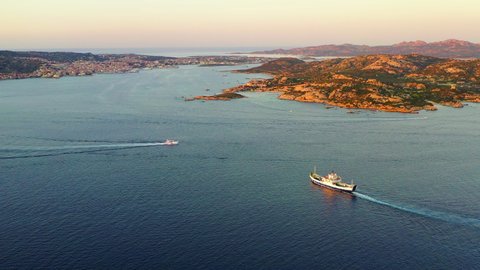 Drone aerial view of a ferry boat going from Palau to La Maddalena, Sardinia, Italy