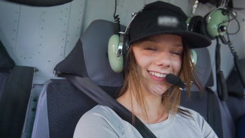 Slow Motion: Pretty Young Woman Laughing in Helicopter - Vancouver, Canada
