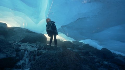 Pan Left to Right: Woman Passing Through the Challenging Area of Mendenhall Glacier of Alaska