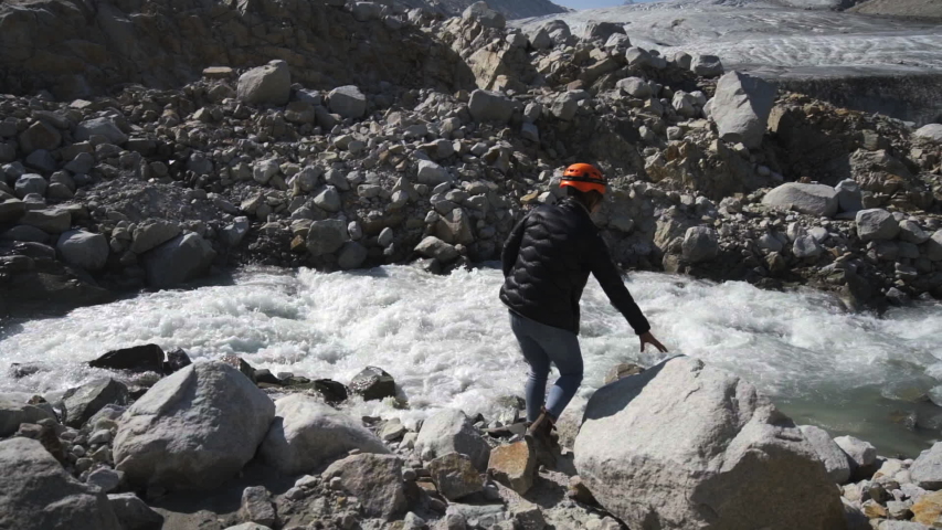 Slow Motion: People By Flowing River Leading Down To Glacier, Between Rocky Mountains - Mendenhall Glacier, Alaska