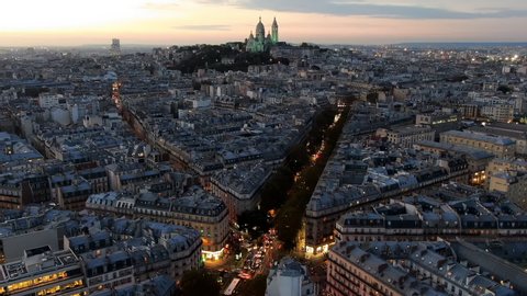 Aerial Time Lapse: Paris City as Sun Sets with Car Headlights and the Sacre-Cur