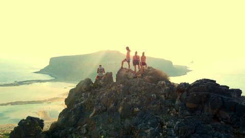 Aerial: Young People on Top of Stunning Mountain at Dawn, Crete, Greece