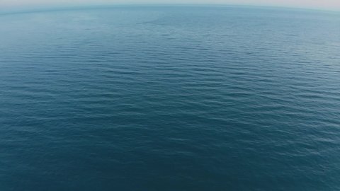Top view of dark blue ocean water and surface . Aerial drone shot over the sea