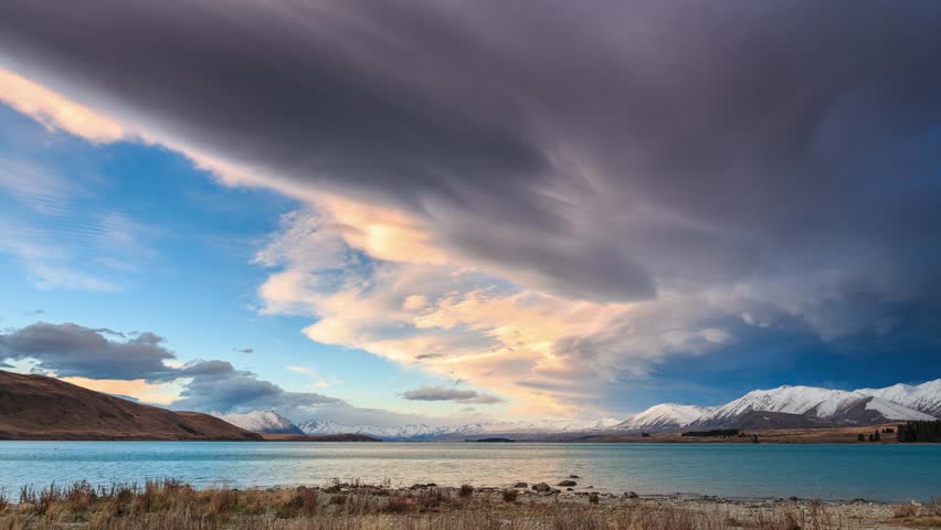Time-lapse of the cloud before sunset moving over Lake Tekapo, South Island, New Zealand. Lake Tekapo is the second-largest of three roughly parallel lakes in the South Island of New Zealand.