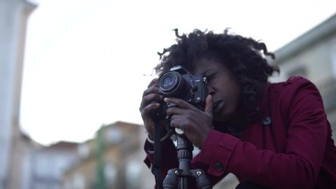Lisbon / Portugal - 12 18 2018: Girl In Purple Coat Using A Camera On A Tripod 2